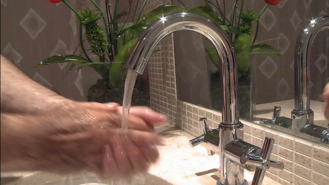 Washing hands in sink hygiene concept