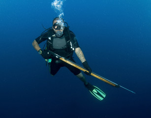 scuba diver with spear gun