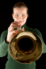 beautiful blonde girl holds a golden trumpet