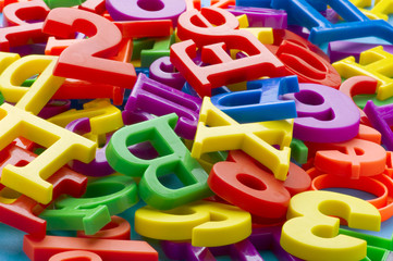 Fototapeta premium letters and numbers on blue closeup