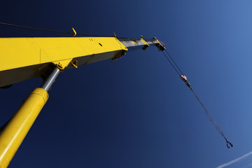 crane arm against a blue sky