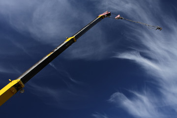 crane arm against a blue sky