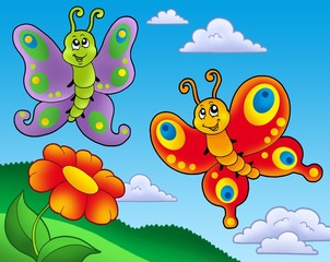 Naklejka premium Two butterflies with red flower