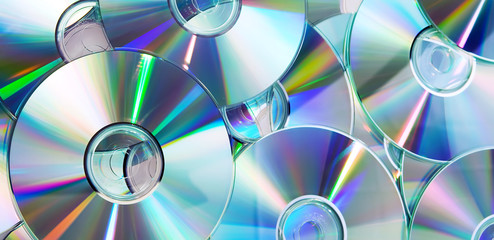 heap of dvd, cd disks - 21437664