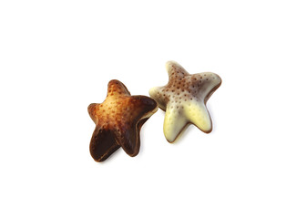 Two chocolate stars on white with clipping path.