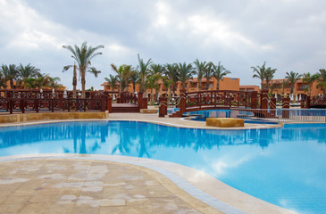 pool with bridge on sky background