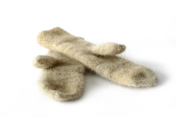 Fototapeta na wymiar mittens of dog wool on white backgraund