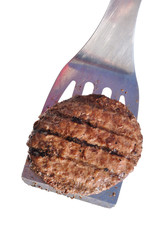 Grilled Hamburger Patty on a Spatula - obrazy, fototapety, plakaty