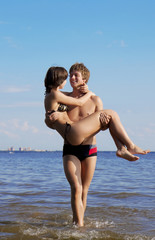 Beautiful people in love on the beach