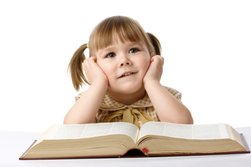 Happy little girl with book, back to school