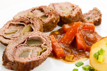 Roasted stuffed pork chop with chips and vegetables