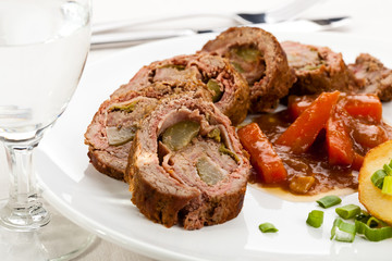 Roasted, stuffed pork chop with chips and vegetables