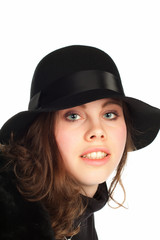 Beautiful young smiling woman with black hat