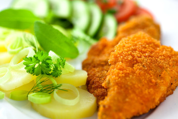 Fish with potatoes and fresh vegetables