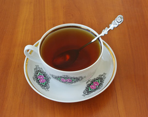 Teacup with spoon on saucer