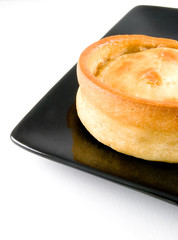 scotch pie on black plate