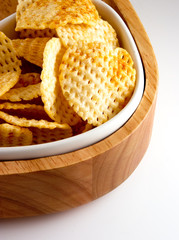 potato crisps chips in wooden bowl