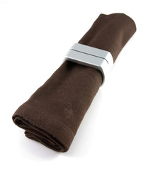 brown cloth napkin with silner napkin ring