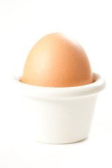 raw brown egg isolated