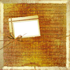 Old grunge photoalbum for photos with bow and ribbons
