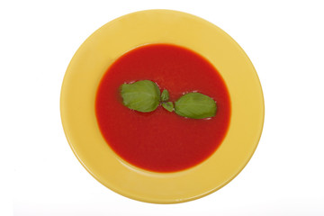 tomato soup in yellow plate
