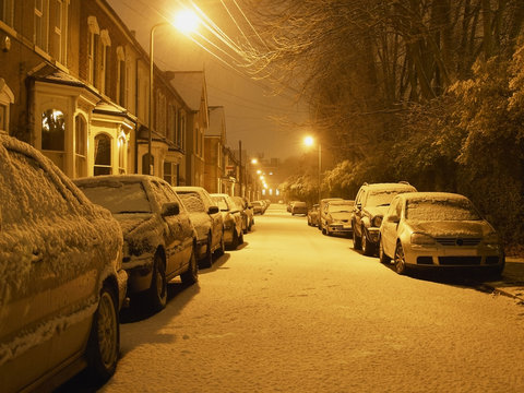 Snowy Residential Street At Night