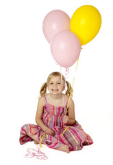 Fototapeta na wymiar Cute Female Child Holding Balloons