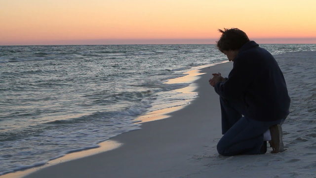 Kneeling Prayer At Sunset