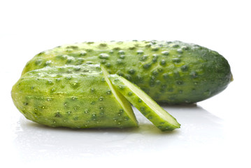 green cucumber with water drops isolated on white