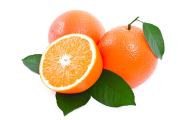 Ripe oranges with green leaves.