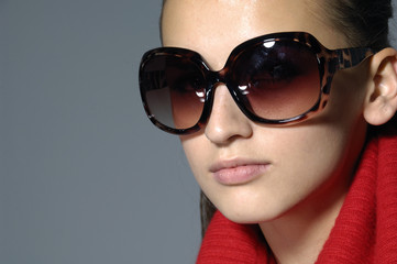 Sunglasses fashion woman on gray