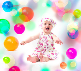 Fototapeta na wymiar baby playing with colorful balloons