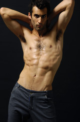 Fototapeta premium Sport and health body of young man. On black