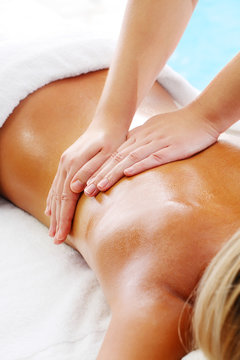 Massage Techniques I - woman receiving professional massage.