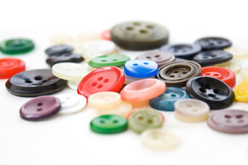 Colorful vintage sewing buttons on white