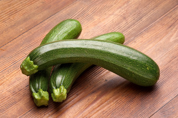 zucchinis on wood background
