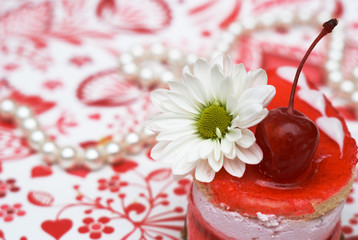 sweet fruit red cake with cherry and white camomile