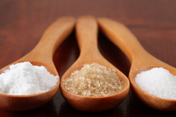 Sugar in wooden spoons
