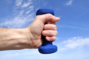 Hands Holding Blue Weight