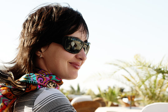 Beautiful woman in neckerchief and sunglasses