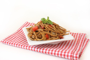 Fried noodles with vegetables and basil