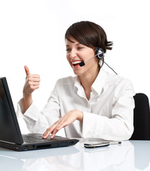 joyful woman operator with headset showing OK
