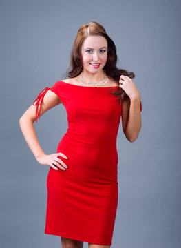 Attractive girl in   red dress