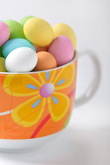 Colored easter eggs in a cup