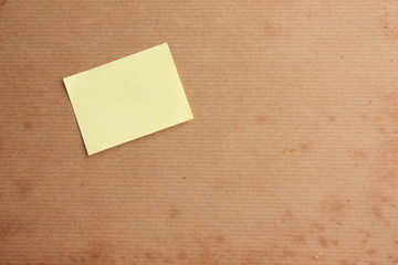 Aged background with post it note