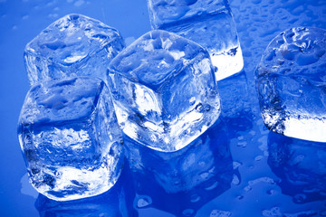 Ice cubes on blue glass