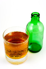 glass of beer and empty bottle