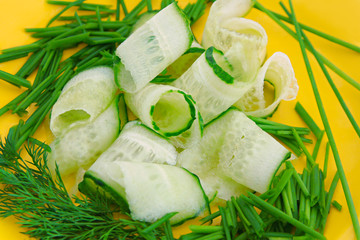 Green vegetables on a yellow background