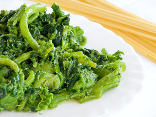 Boiled turnips on white dish with spaghetti.