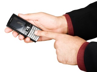 Businessman's hand holding a cell phone - isolated on white